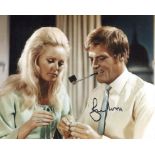 Roger Moore as The Saint signed 8x10 photo. Good condition. All autographs come with a Certificate