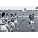 Autographed DANNY McGRAIN 12 x 8 photo - B/W, depicting the Celtic captain throwing the Scottish Cup