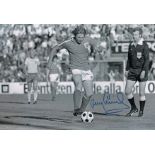 Autographed TONY CURRIE 12 x 8 photo - B/W, depicting the England midfielder in full length action