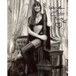 007 Bond actress Caroline Munro signed sexy pose 8x10 photo. Good condition. All autographs come