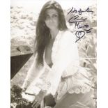 Caroline Munro signed sexy pose photo. Good condition. All autographs come with a Certificate of