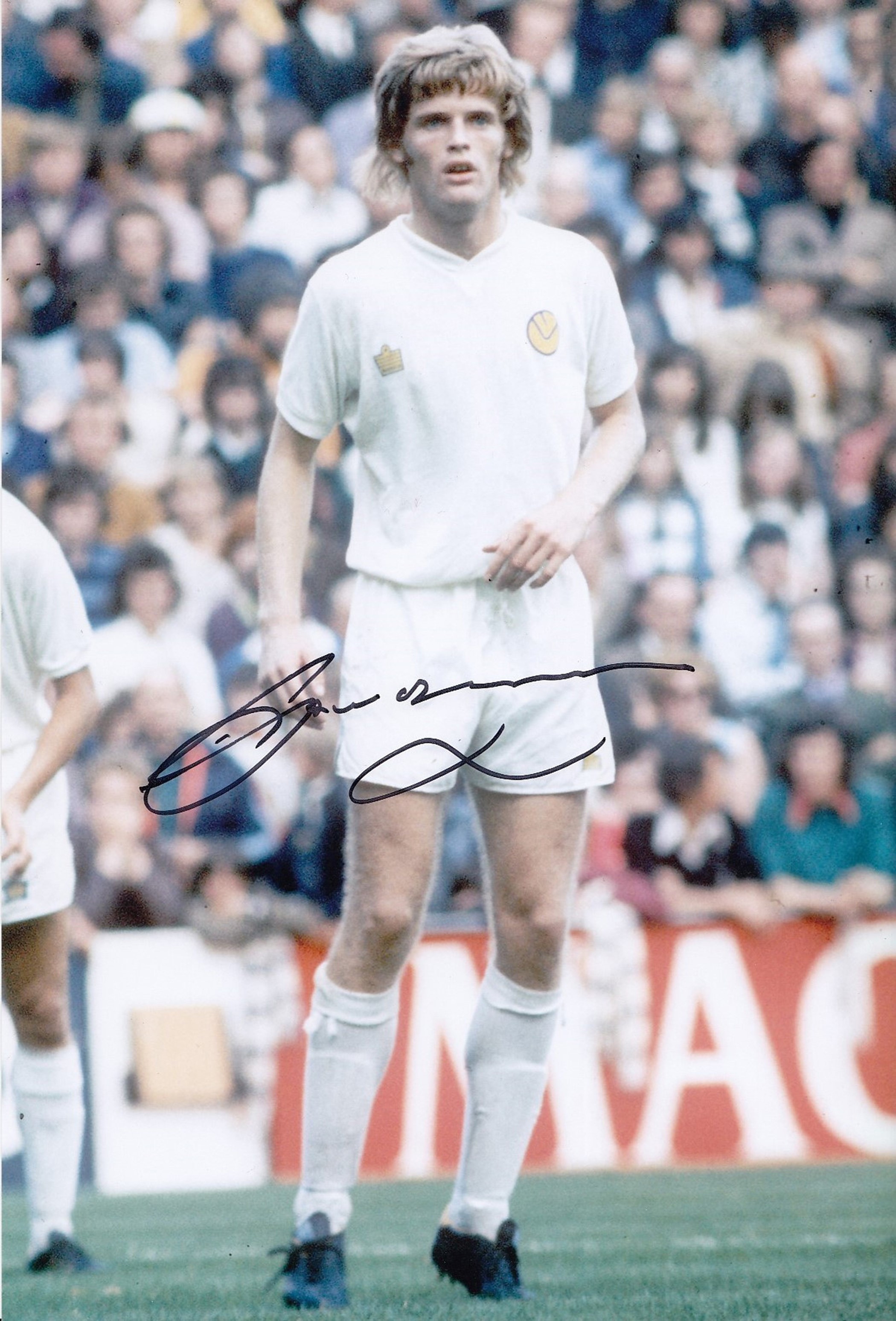 Autographed GORDON McQUEEN 12 x 8 photo - Col, depicting the Leeds United centre-half in full length