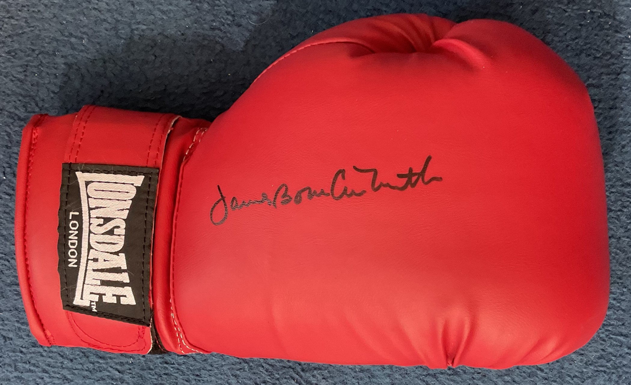 James Bonecrusher Smith Signed Red Lonsdale Boxing Glove. Signed in black ink. Good condition. All