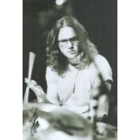 Joe Donovan signed 12x8 black and white photo. Drummer. Good condition. All autographs come with a