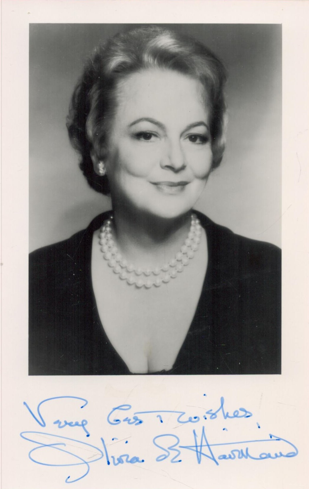 Olivia De Havilland Signed 5. 5 x 3. 5 inch Black and White Photo. Signed in blue ink. Good