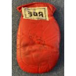 Irish Boxer Barry McGuigan Signed Used Red BBE Fighting Mitt. Signed in black ink. Showing Signs