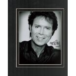 Cliff Richard signed 14x12 overall mounted black and white photo. Good condition. All autographs