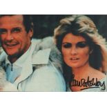 Bond Girl, Carole Ashby signed 10x8 colour photograph pictured alongside Roger Moore as Whistling