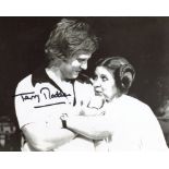 Star Wars movie director Terry Madden signed 8x10 candid photo with Carrie Fisher. Good condition.