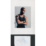 Simon Webbe signature piece featuring a colour photograph and a signed white card. The colour