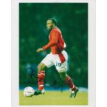 Darius Vassell signed England 12x8 colour photo. Darius Martin Clarke Vassell (born 13 June 1980) is