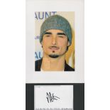 Kevin Richardson signature piece featuring a colour photograph and a signed white card. The colour