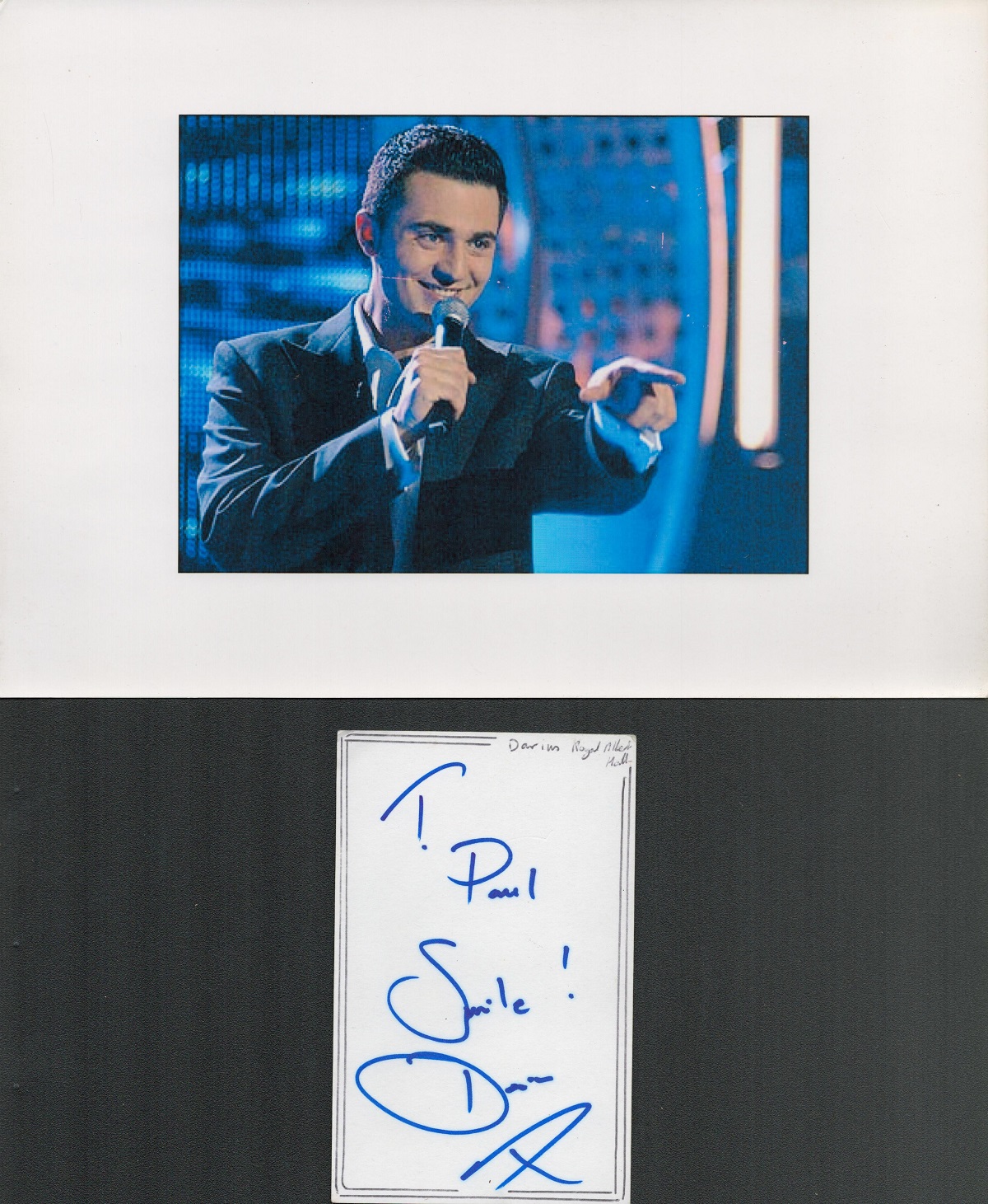 Darius Campbell signature piece featuring a colour photograph and a signed white card. The colour