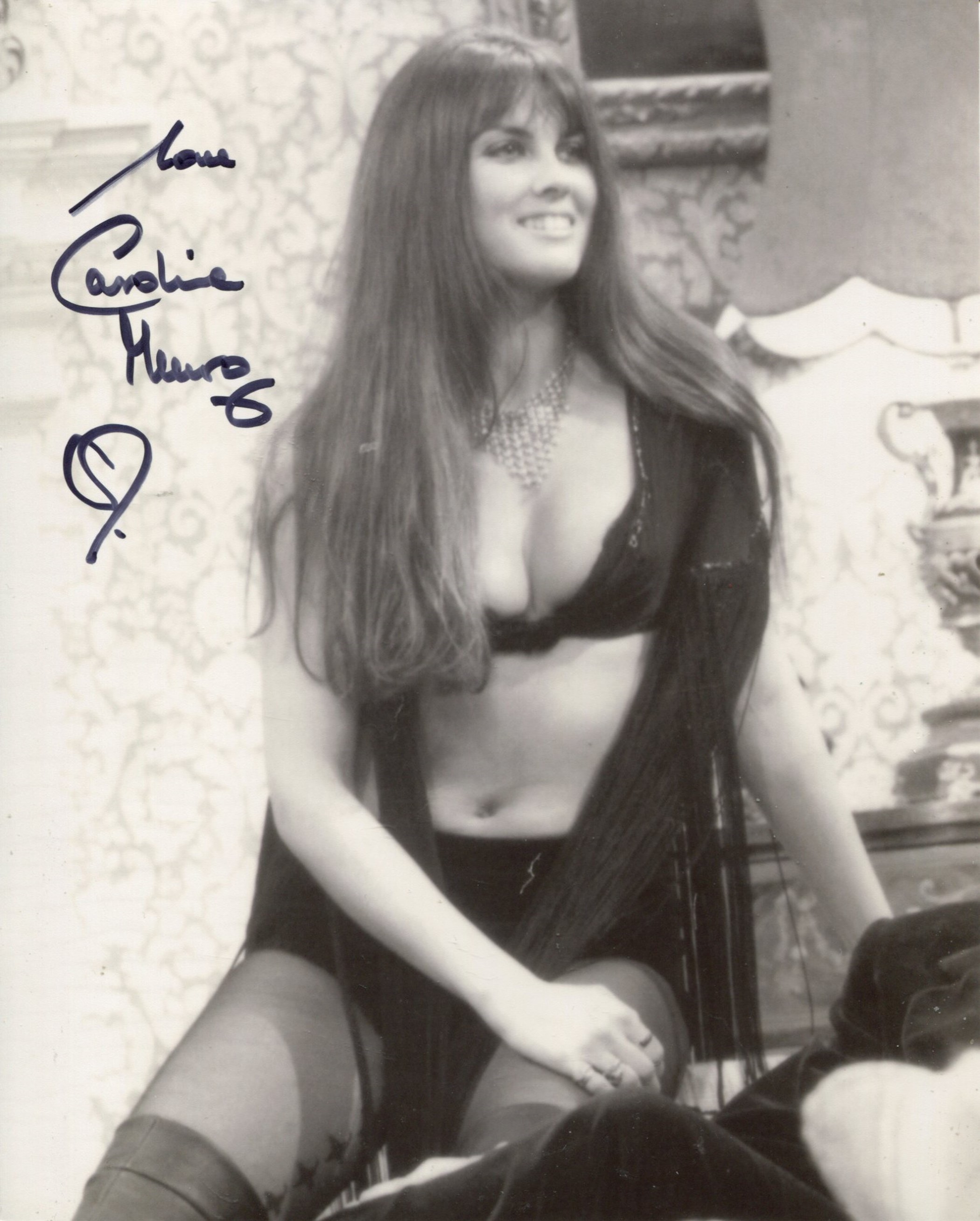 007 Bond actress Caroline Munro signed sexy pose 8x10 photo. All autographs come with a