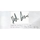 Hank Azaria signed 3x4 white card attached to white paper. Azaria is an American actor, comedian,