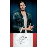 Hozier signature piece featuring a 10 x8 colour photograph and a signed card. Hozier Byrne (born