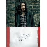 Hozier signature piece featuring a 10 x8 colour photograph and a signed card. Hozier Byrne (born