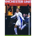 Autographed JERMAINE BECKFORD 16 x 12 photo - Col, depicting the Leeds United striker running away