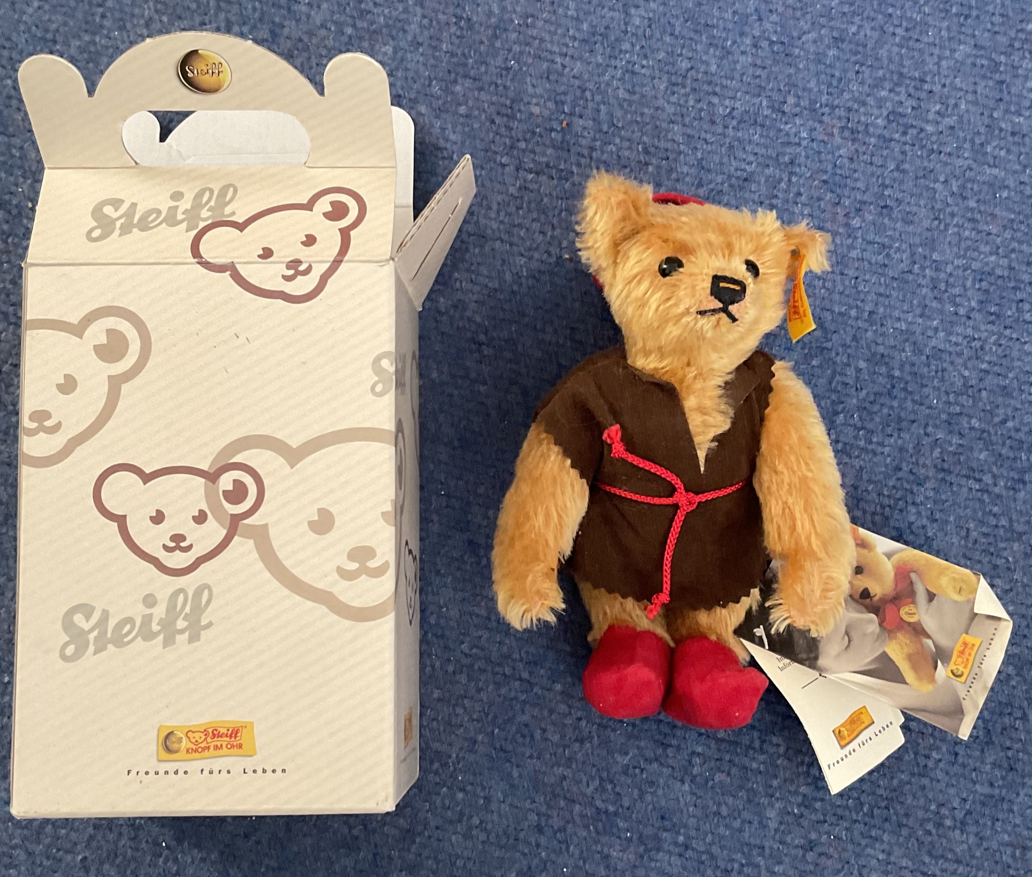 Steiff Classic Teddy Bear 2002 With red hat and boots and brown robe with red rope. Come with