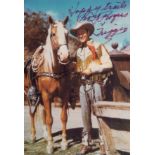 Roy Rogers signed 6 x 4 inch colour photo with Trigger. Good condition. All autographs come with a