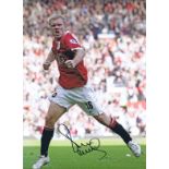 Autographed PAUL SCHOLES 16 x 12 photo - Col, depicting the Manchester United midfielder celebrating