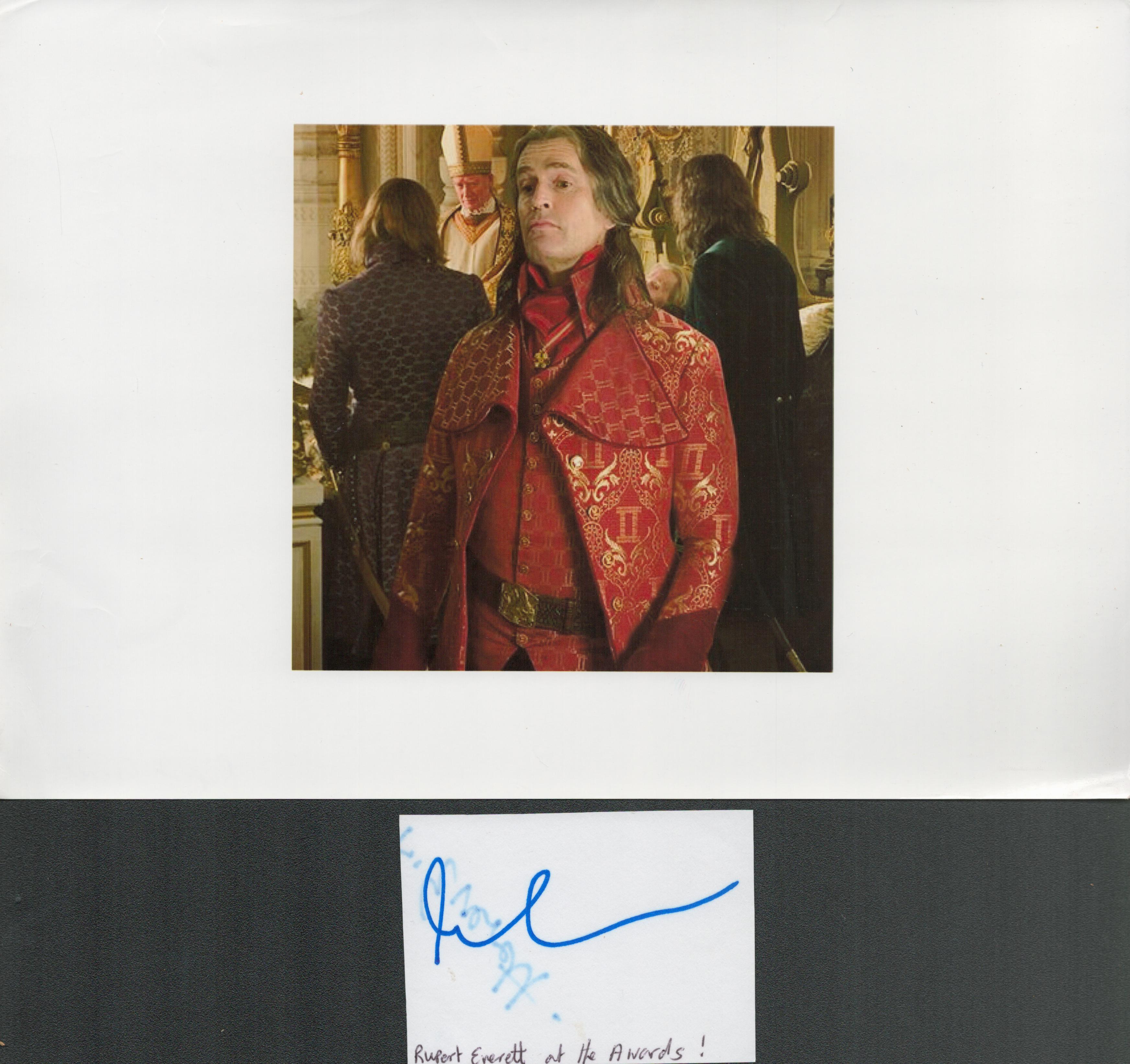 Rupert Everett signature piece featuring a signed white card and a colour photograph. This 12x8