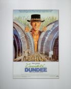 Paul Hogan is Crocodile Dundee Colour Magazine Cutting, Attached to Board, Further attached to Card.