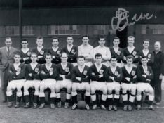 Autographed Ian Ure 8 X 6 Photo - B/W, Depicting Dundee Players Posing For A Squad Photo During A
