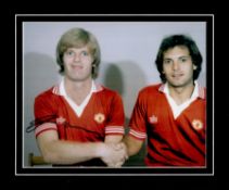 Gordon McQueen signed 12x10 overall mounted colour photo pictured with Ray Wilkins during his time