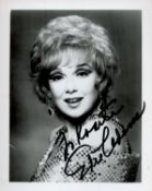 Edie Adams signed 5x5 black and white photo. Dedicated. Good condition. All autographs come with a