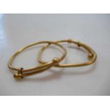 Two misshapen childrens bangles, tested as 22ct gold, gross weight 30.8g (2)