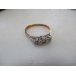 A three stone diamond ring, estimated approximate total diamond weight 0.10ct, stamped '18CT',