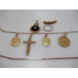 four pendants tested as 18ct gold attached to a base metal chain, together with an onyx pendant