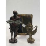 A Bergmann style bronze standing figure holding two large flower heads, 20.5cm high; a dancer with