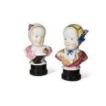 A pair of large 19th century Meissen porcelain busts of the Bourbon children,
