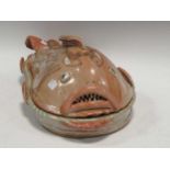 Willie Carter, a glazed stoneware serving dish and cover in the modelled as a fish, stamped 'Willie'