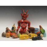A collection of ceramic and wooden fruit and vegetables, a wooden figure, metal figure of a