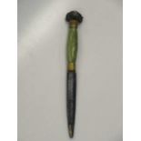 An onyx handle letter knife with bronze rams head terminal, early 20th century, 32cm with sheaf