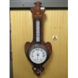 An Art Nouveau inlaid rosewood barometer