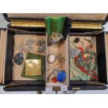 A jewellery box containing various items of jewellery, including a spray brooch tested as 9ct