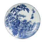 A Japanese blue and white porcelain large peacock charger, late Meiji Period (1868-1912),