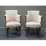 A pair of mahogany tub easy armchairs, the scroll end armrests on turned supports and cabriole