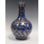 A Chinese bottle vase, the blue ground body gilt with mons, 40cm highCondition report: Rubbing to