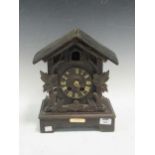 A Black Forest clock with a plaque dating 1880, together with another wall clock, A/F (2)
