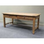 A 19th Century French oak kitchen table fitted with drawer on square legs united by an H pattern