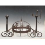 An iron kitchen hanging meat hooks with bird finials; a French rush light and a pair of fire