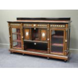 A late 19th century ebony and amboyna credenza with inset Sevres style porcelain oval panels 106 x