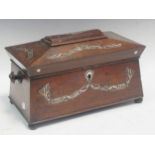 A Victorian rosewood tea caddy of sarcophogus form fitted with two canisters and for a mixing