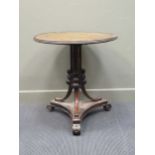 A Victorian leather topped circular table, 76 high x 71 cm wide