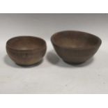 Two treen bowls, largest 9cm high and 20cm diameter